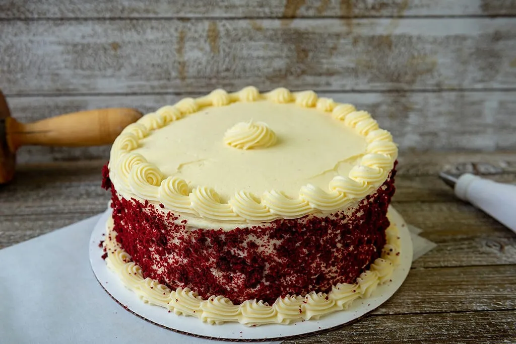 A slice of red velvet cake with cream-cheese frosting